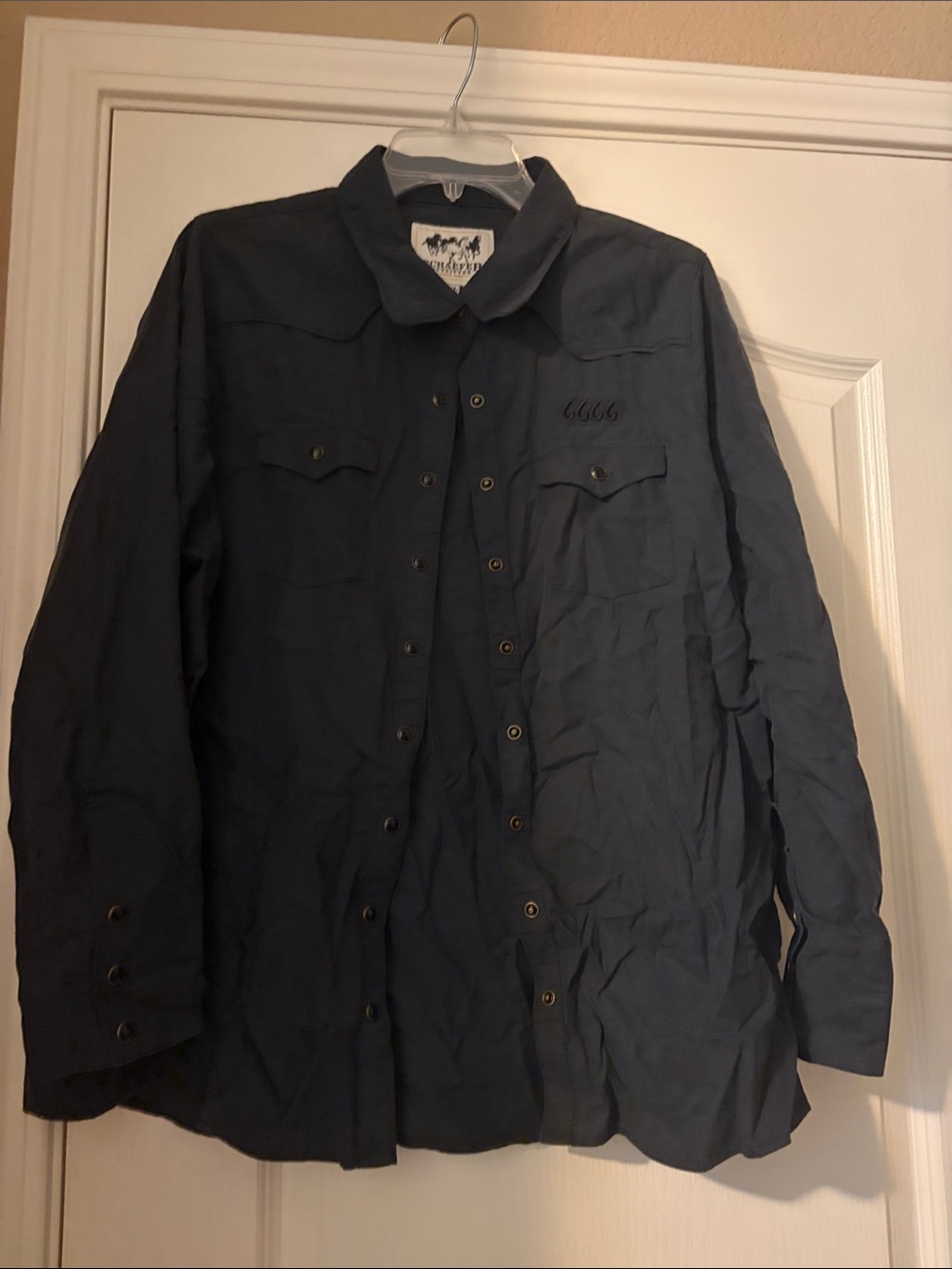 Women’s button down western shirt with the four sixes logo embroidered on it